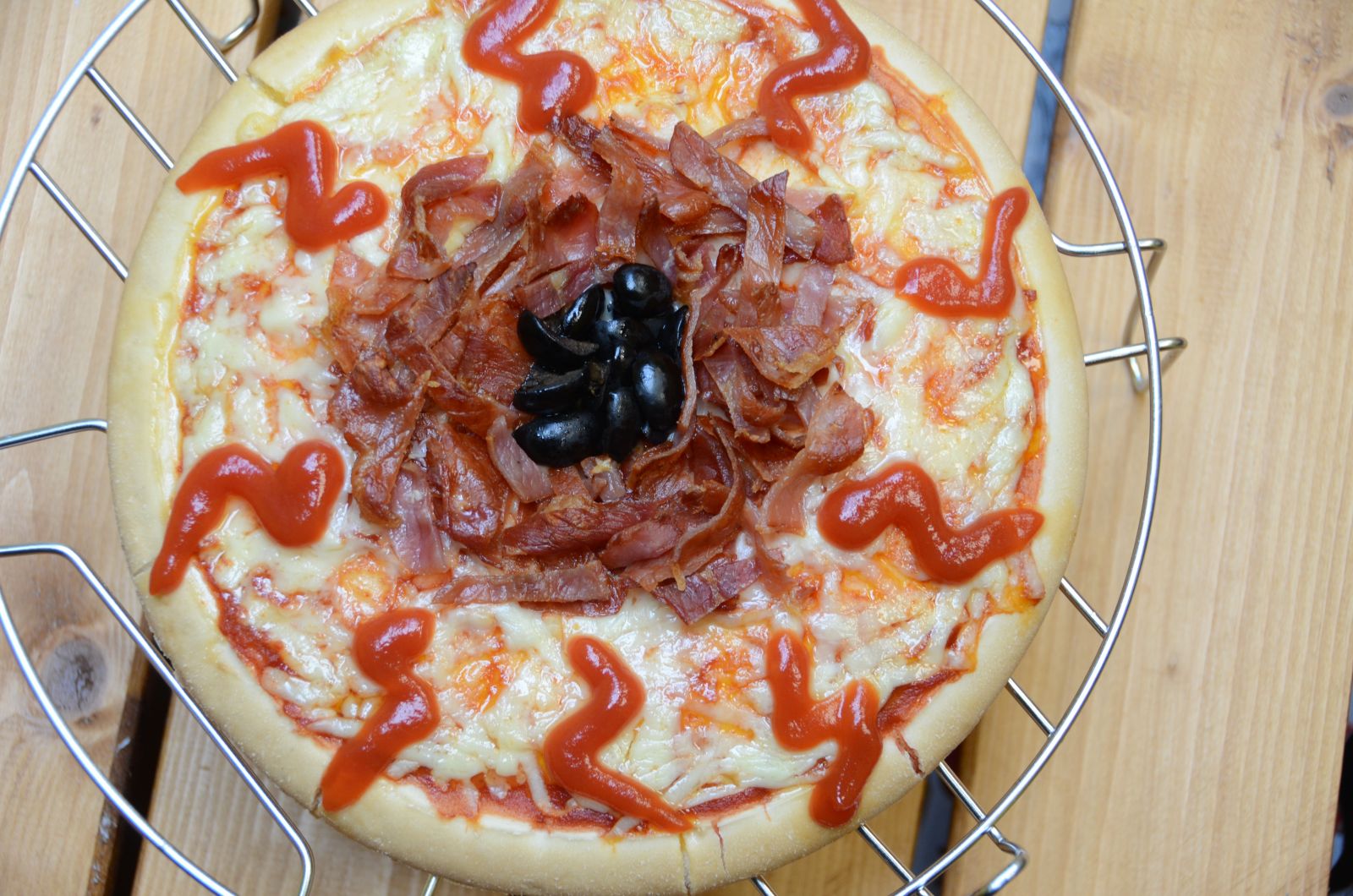 Pizza with Toppings that look like a Bloodshot Eyeball.